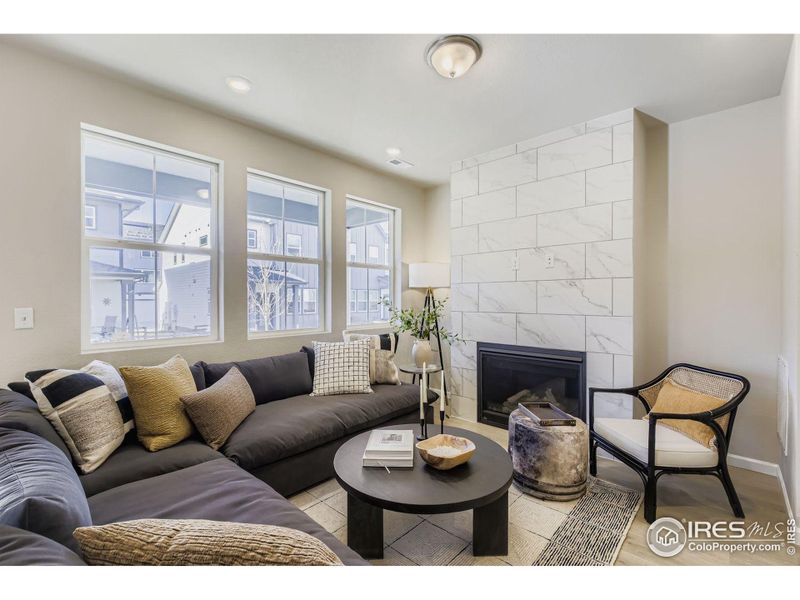 Cozy great room centered by a gas fireplace