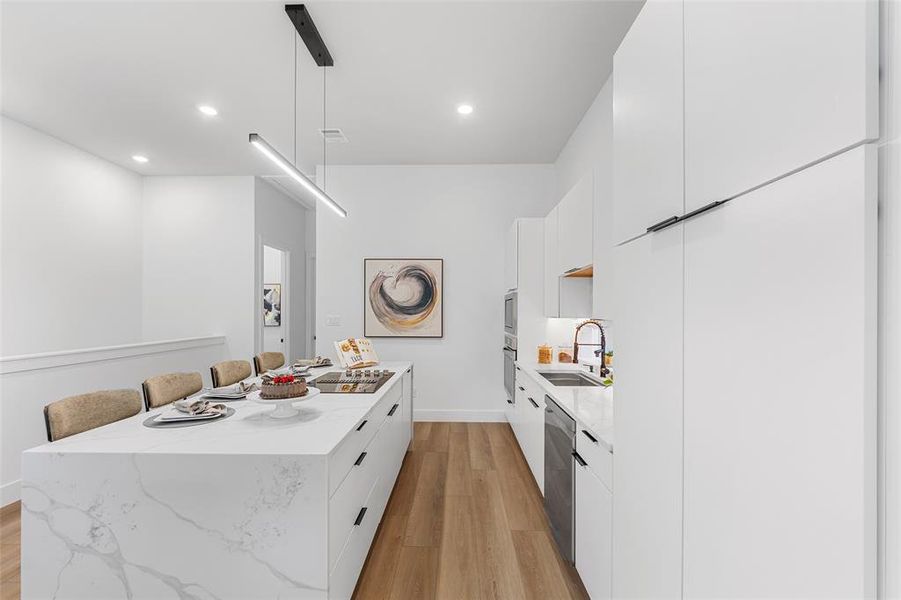 Kitchen with modern cabinets, a center island, dishwasher, white cabinetry, and recessed lighting Kitchen with modern cabinets, a center island, dishwasher, white cabinetry, and recessed lighting