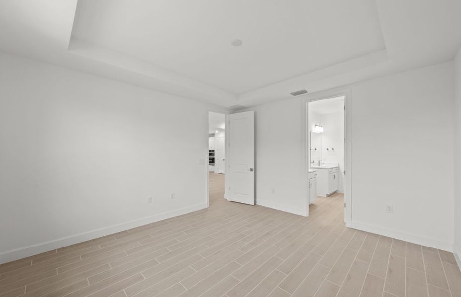 Representative unfurnished interior of a home built from the Concord by DiVosta in Talon Preserve on Palmer Ranch, Nokomis (Image 26).