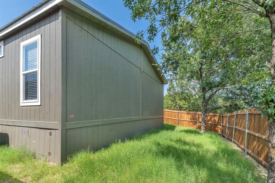 Exterior details and patio area of a home in , Granbury (Image 18).