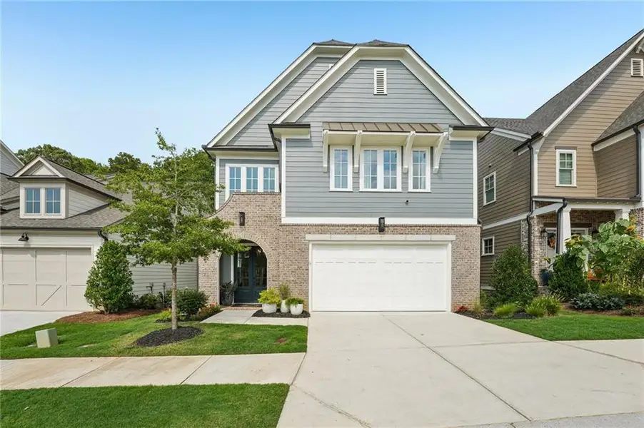 Front exterior of a new home in Lakeside at River Green, Canton, GA, highlighting curb appeal (Image 22).