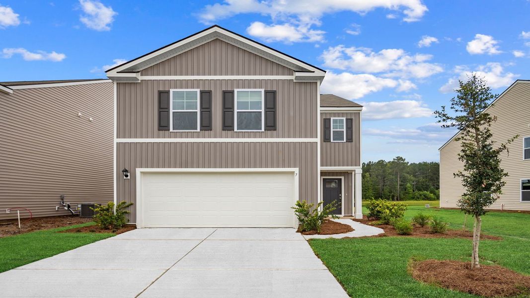 Front exterior of a new home in Rice Hope, Port Wentworth, GA, highlighting curb appeal (Image 1).