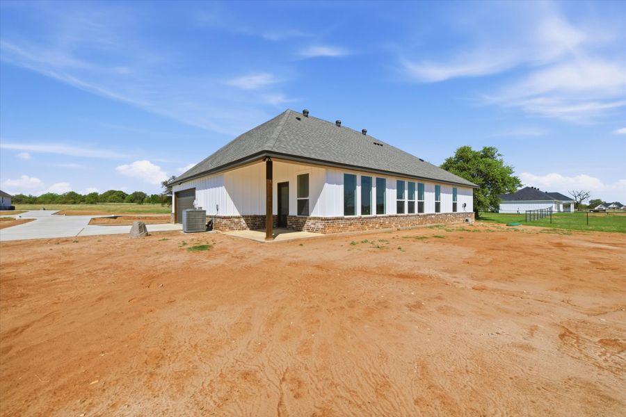 Front exterior of a new home in Zion Valley, Poolville, TX, highlighting curb appeal (Image 14). Front exterior of a new home in Zion Valley, Poolville, TX, highlighting curb appeal (Image 14).
