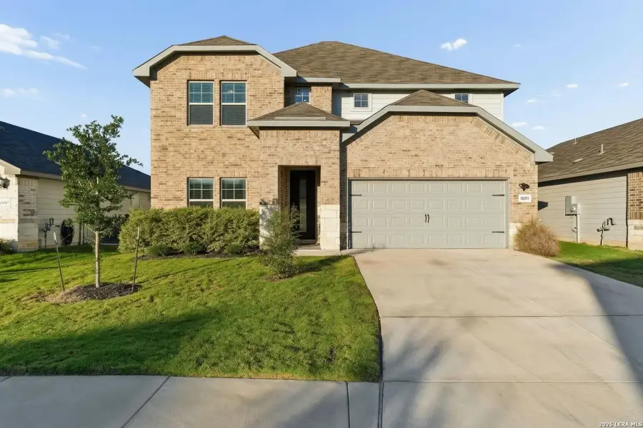 Front exterior of a new home in Autry Pond, San Antonio, TX, highlighting curb appeal (Image 2).