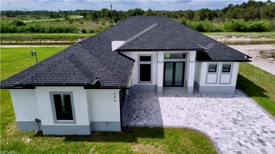 Front exterior of a new home in , Lehigh Acres, FL, highlighting curb appeal (Image 1). Front exterior of a new home in , Lehigh Acres, FL, highlighting curb appeal (Image 1).