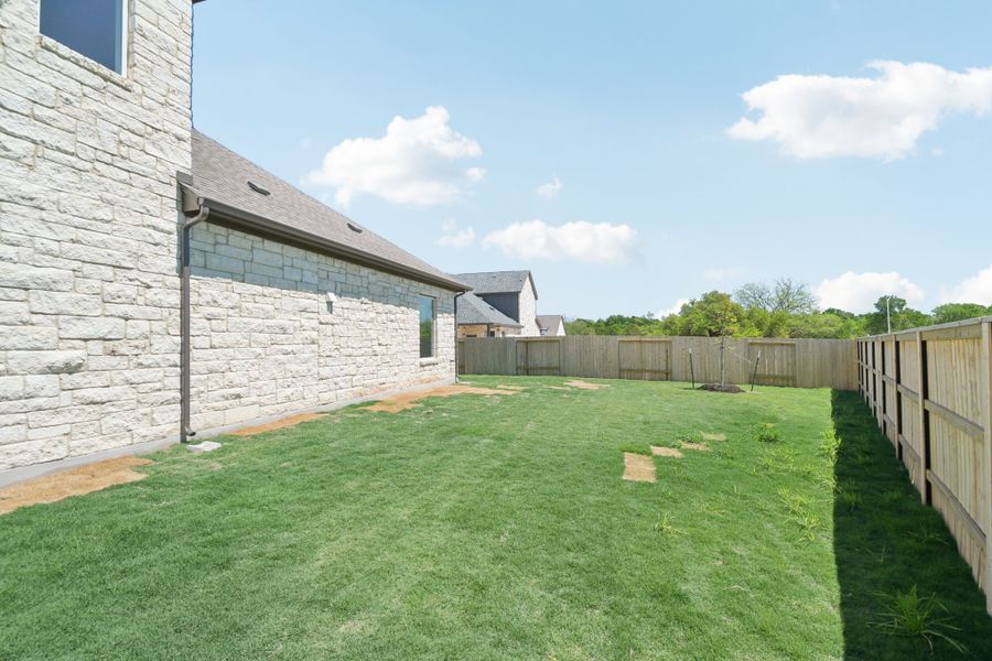 Exterior details and patio area of a home in Persimmon, Buda (Image 14).