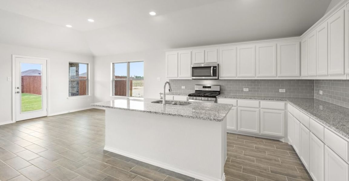 Representative exterior photo of a completed home built from the Atlanta by Impression Homes in Baker Farms, Cleburne, TX (Image 5). Representative exterior photo of a completed home built from the Atlanta by Impression Homes in Baker Farms, Cleburne, TX (Image 5).