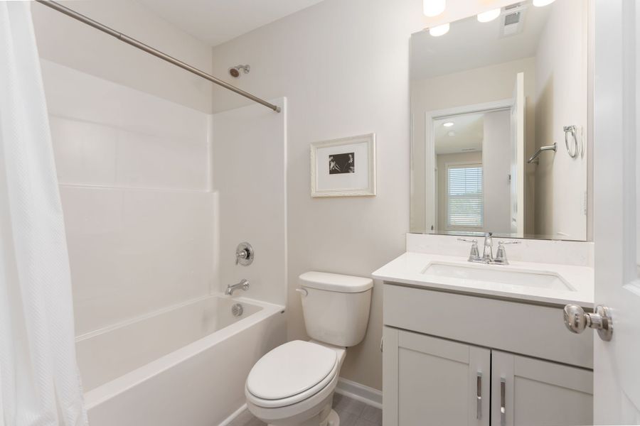 Furnished interior view inside a new home in River Tide Farms, Bolivia (Image 22).