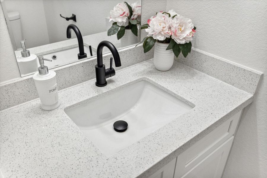 Elegant powder room conveniently located on 1st floor