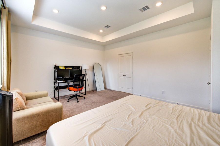 The expansive primary suite offers generous space to accommodate a desk, sitting area, or additional dressers, allowing for easy customization to suit your lifestyle. Designed for comfort and versatility, this inviting retreat also provides direct access to a spacious walk-in closet and a private bathroom, creating a well-appointed and relaxing sanctuary.