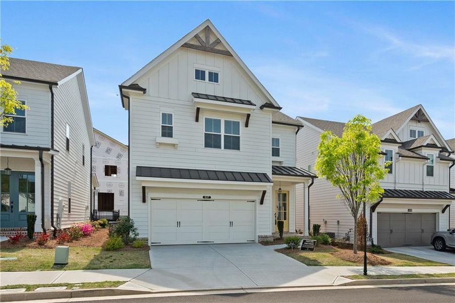 Front exterior of a new home in Palisades Single Family, Cumming, GA, highlighting curb appeal (Image 26).
