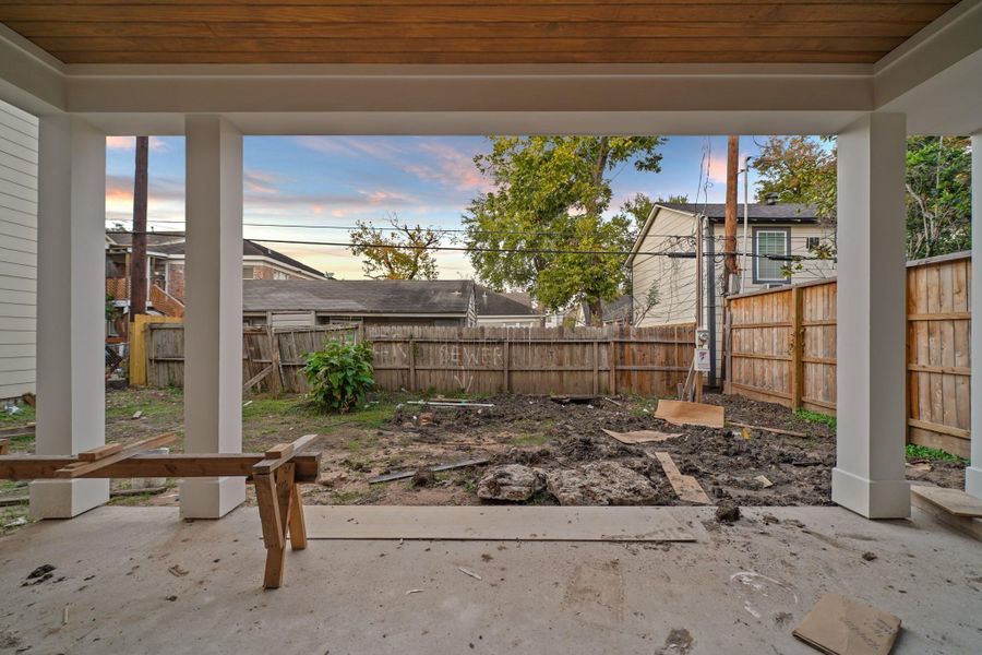 Through the double sliders onto your covered back patio complete with summer kitchen!