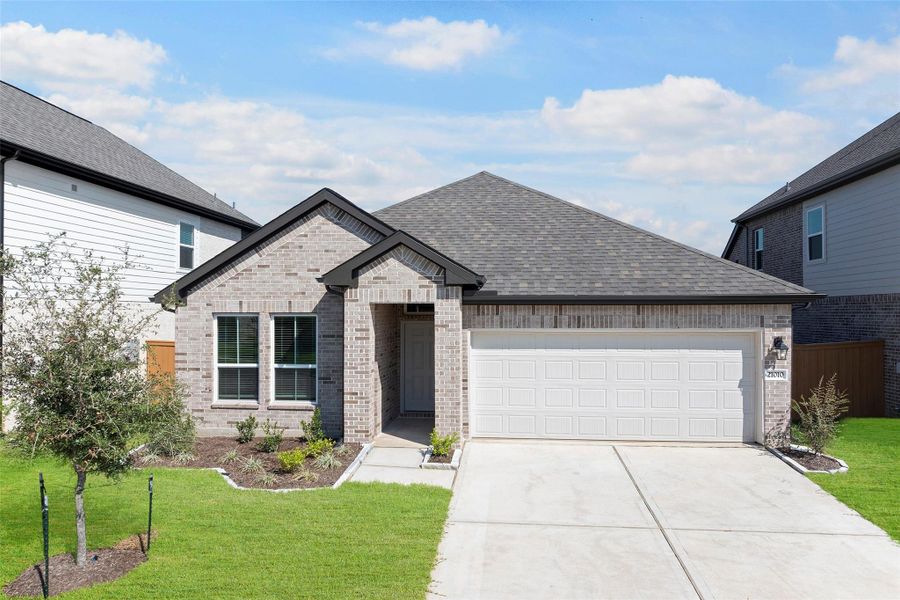 Front exterior of a new home in , Cypress, TX, highlighting curb appeal (Image 2).