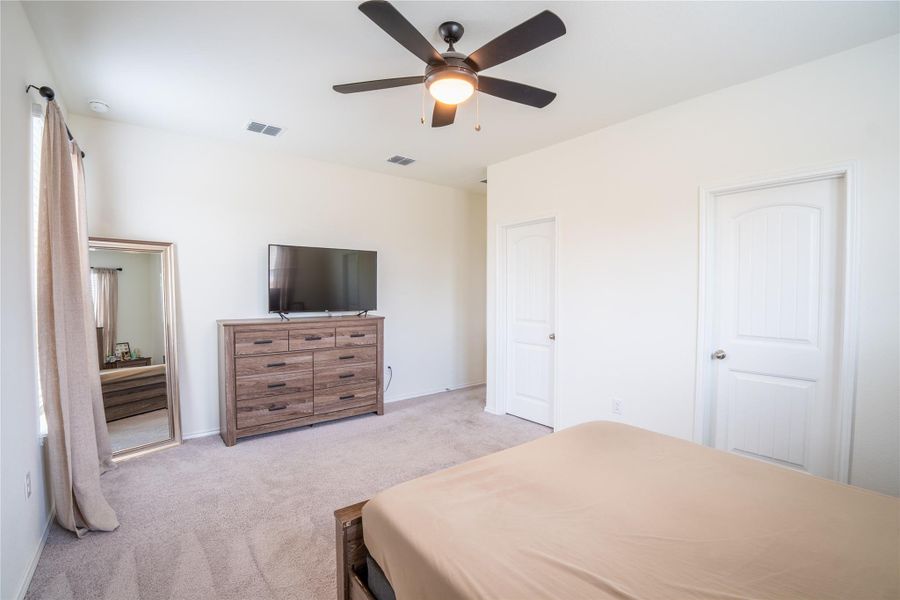 Bright room with neutral wall tones and plush carpet flooring Bright room with neutral wall tones and plush carpet flooring
