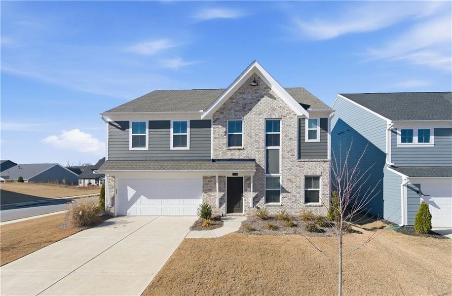 Front exterior of a new home in Twin Lakes, Hoschton, GA, highlighting curb appeal (Image 25).