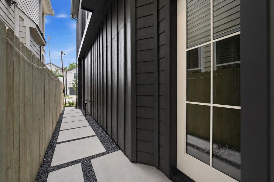 A stone pathway leads to the welcoming front entrance.