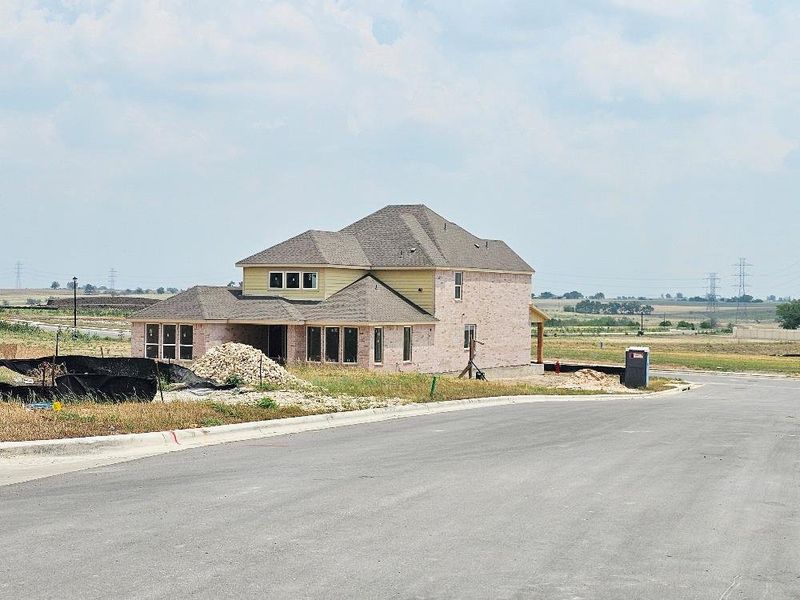 View of front of home featuring brick siding View of front of home featuring brick siding