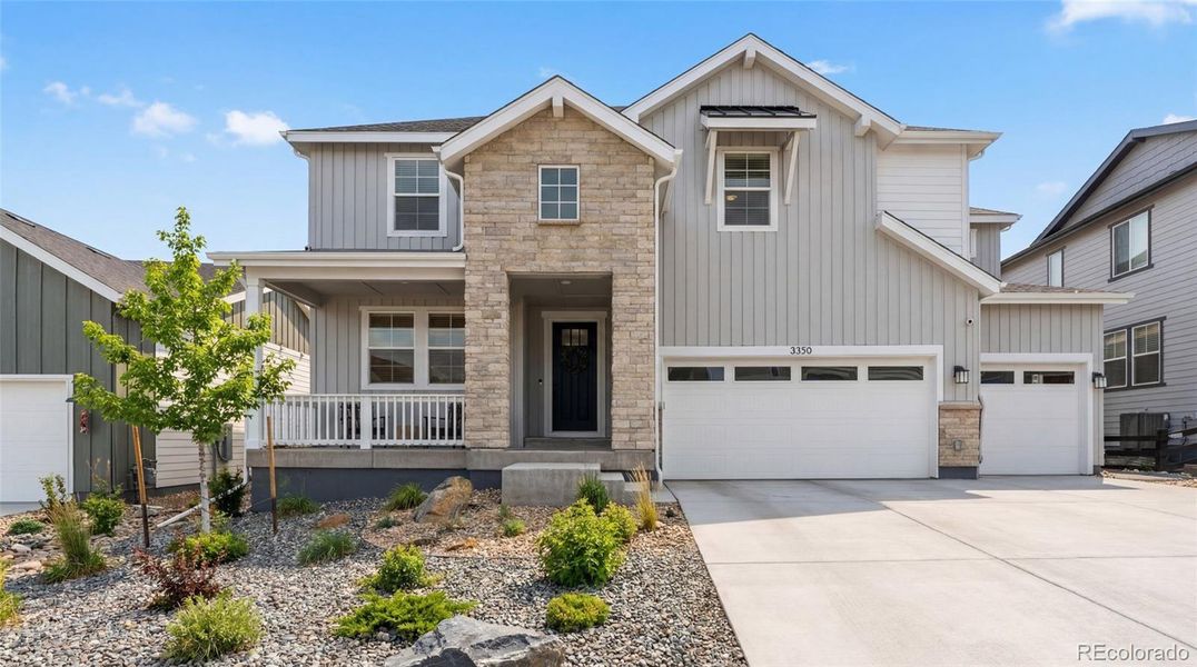 Front exterior of a new home in Macanta Destination Collection, Castle Rock, CO, highlighting curb appeal (Image 1). Front exterior of a new home in Macanta Destination Collection, Castle Rock, CO, highlighting curb appeal (Image 1).