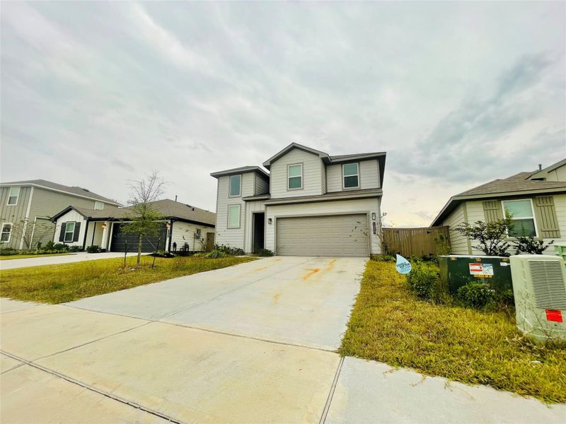 Front exterior of a new home in Presswoods, Splendora, TX, highlighting curb appeal (Image 2).