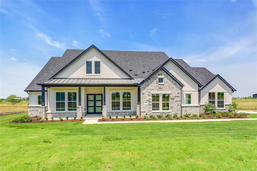 View of front of home featuring a front lawn