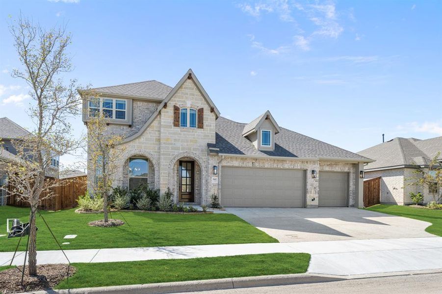Front exterior of a new home in Waterscape, Royse City, TX, highlighting curb appeal (Image 2).