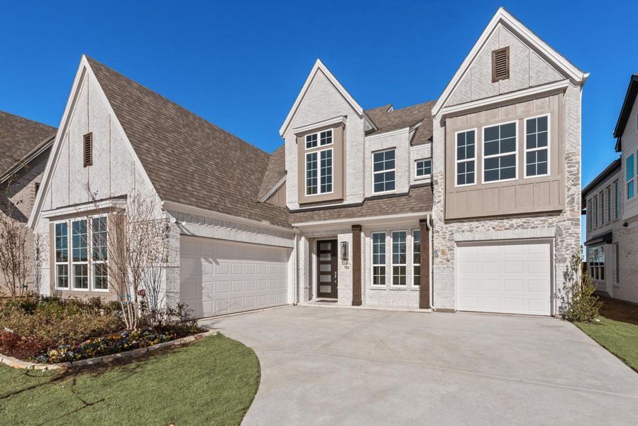 Front exterior of a new home in Grand Estates of Anna, Anna, TX, highlighting curb appeal (Image 2). Front exterior of a new home in Grand Estates of Anna, Anna, TX, highlighting curb appeal (Image 2).