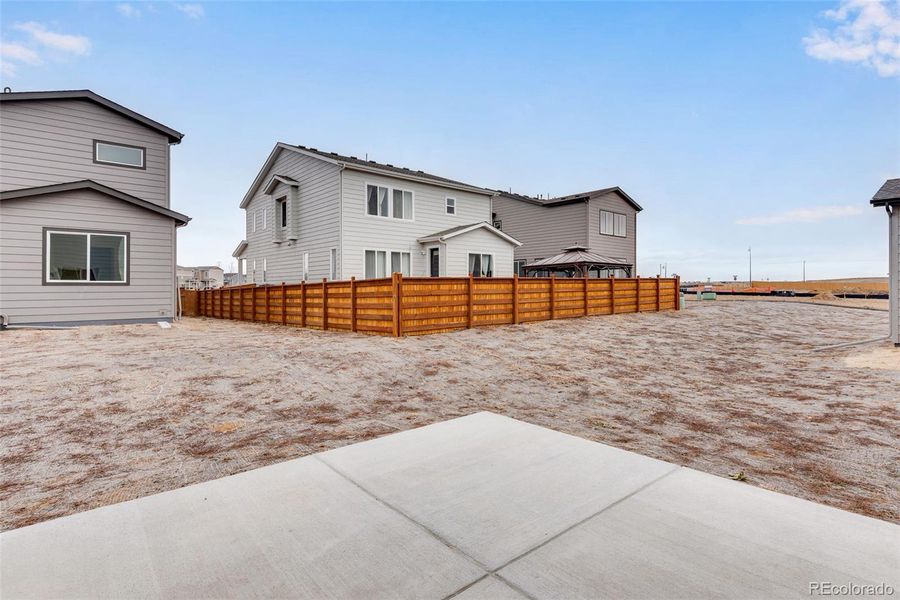 Exterior details and patio area of a home in Reunion, Commerce City (Image 26).