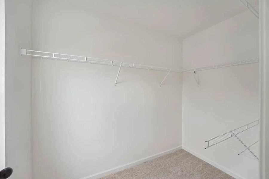 Primary Bedroom Walk-In Closet Primary Bedroom Walk-In Closet