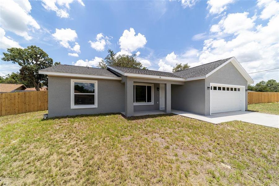 Front exterior of a new home in , Ocklawaha, FL, highlighting curb appeal (Image 24).