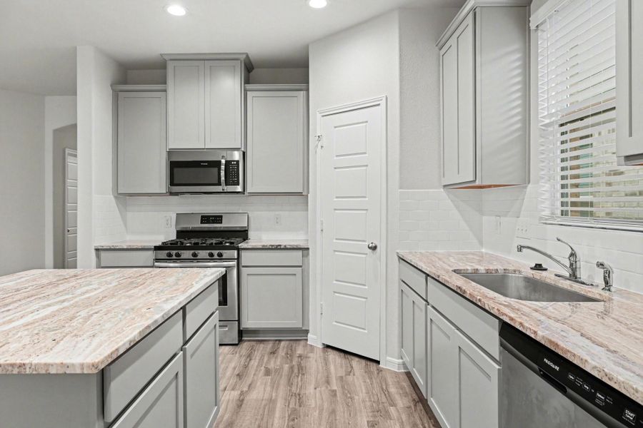 Built-in microwave and generous cabinet space. Built-in microwave and generous cabinet space.