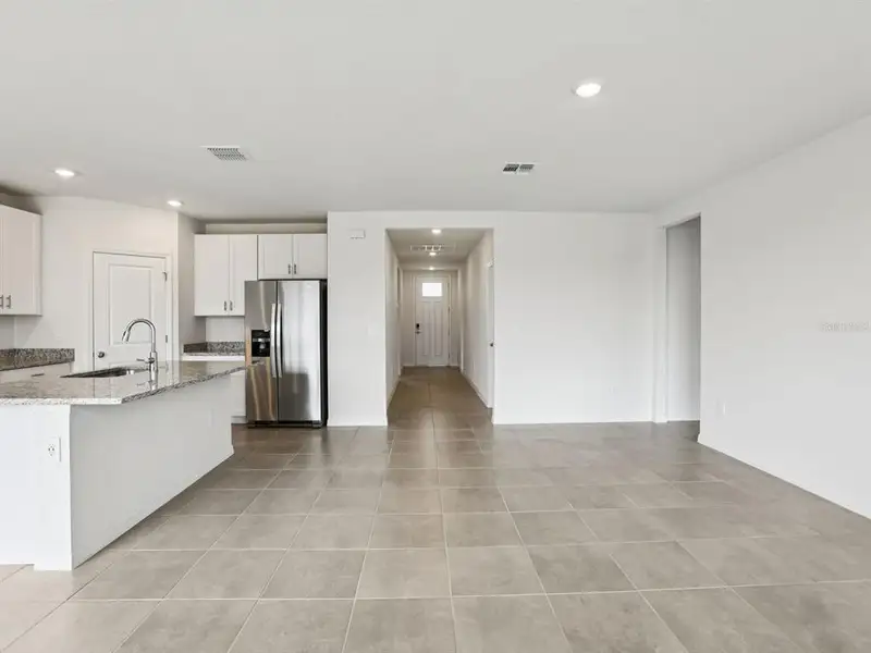 Spacious, unfurnished interior of a new home in The Reserve at Van Oaks, Auburndale (Image 10).