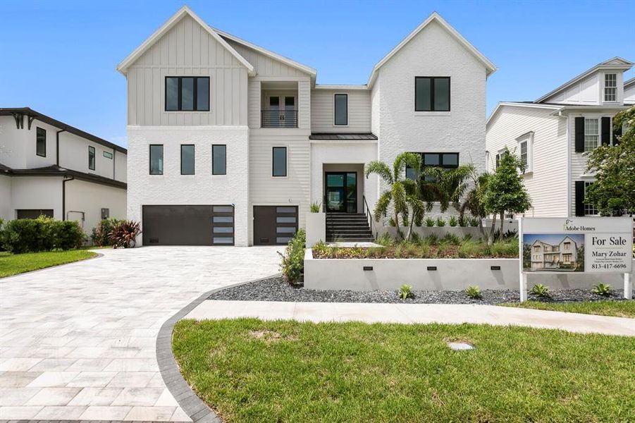 Front exterior of a new home in , Tampa, FL, highlighting curb appeal (Image 30).