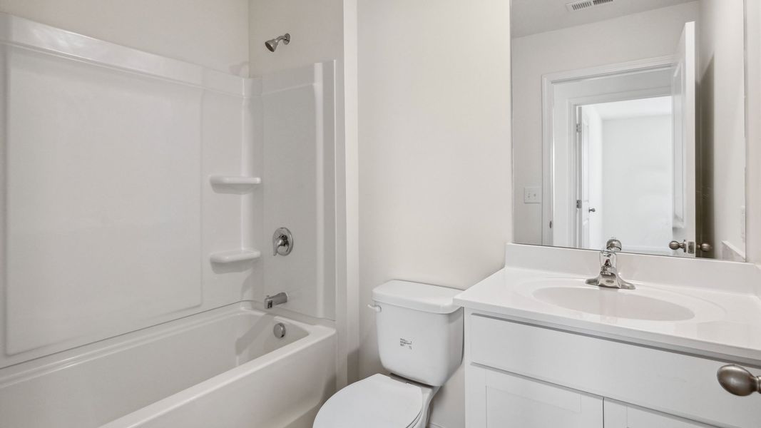 Representative furnished interior of a home built from the Bennet by D.R. Horton in The Hideaway at Fox Meadows, Bluff City (Image 12).