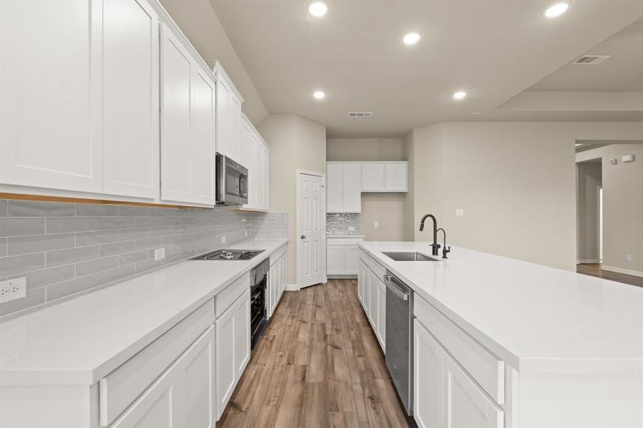 This kitchen is not only a functional space but also has ample storage. Whether you're a seasoned chef or just love to gather and enjoy good food, this kitchen is a dream come true.