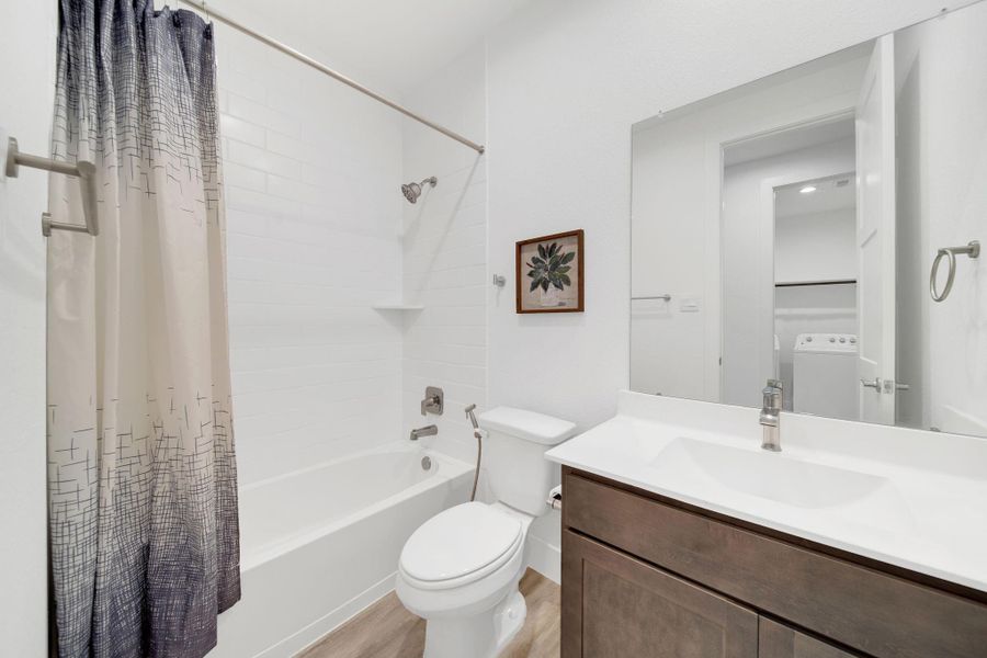 There are two secondary full bathrooms, both boasting a modern design while remaining highly functional.