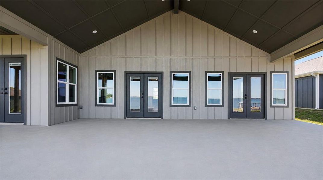 Spacious concrete patio with a vaulted ceiling and recessed lighting Spacious concrete patio with a vaulted ceiling and recessed lighting