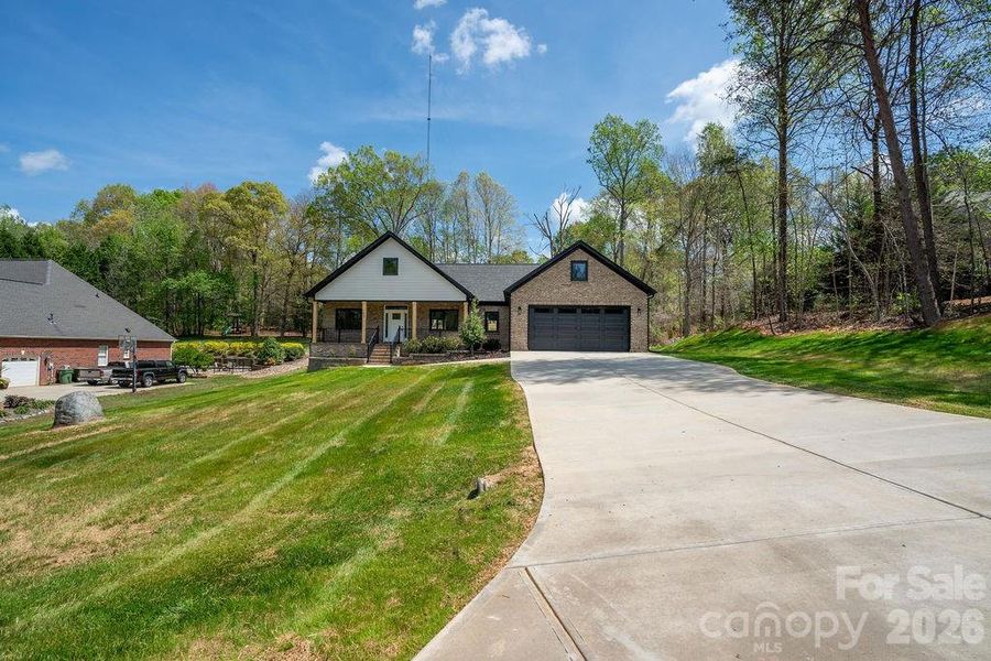 Front exterior of a new home in , Dallas, NC, highlighting curb appeal (Image 2). Front exterior of a new home in , Dallas, NC, highlighting curb appeal (Image 2).