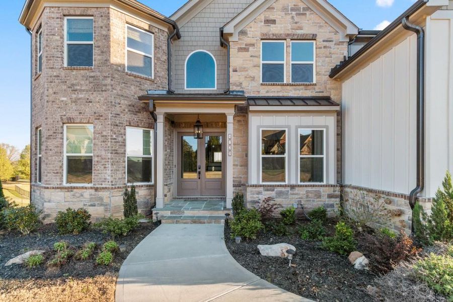 Front exterior of a new home in , Flowery Branch, GA, highlighting curb appeal (Image 25).