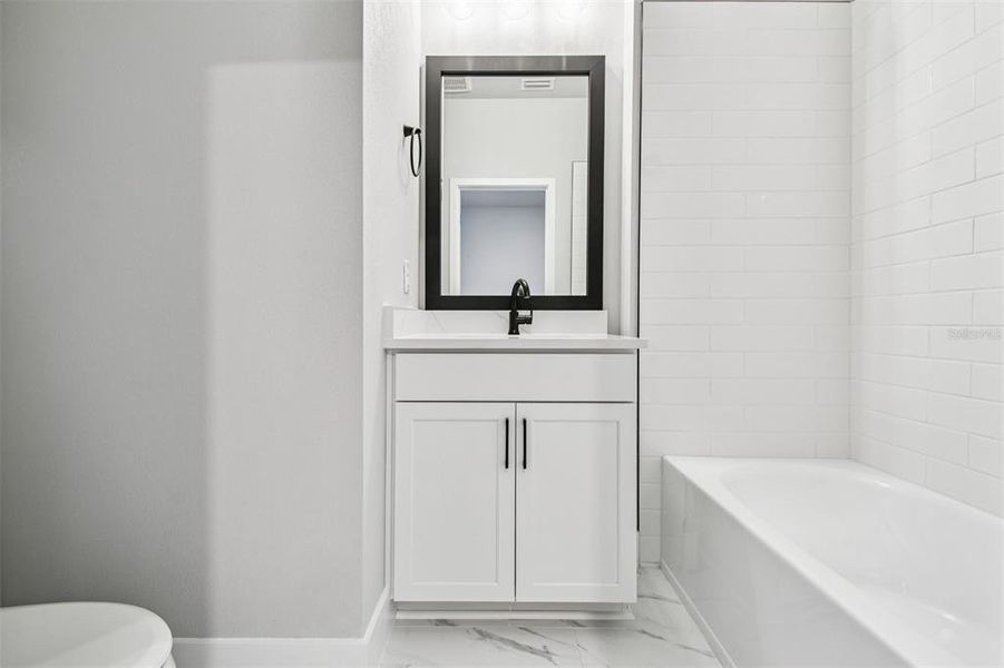 Furnished interior view inside a new home in Towns at Union, St. Petersburg (Image 28).