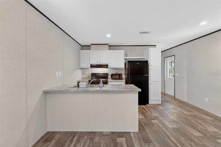 Furnished interior view inside a new home in , Bushnell (Image 3).
