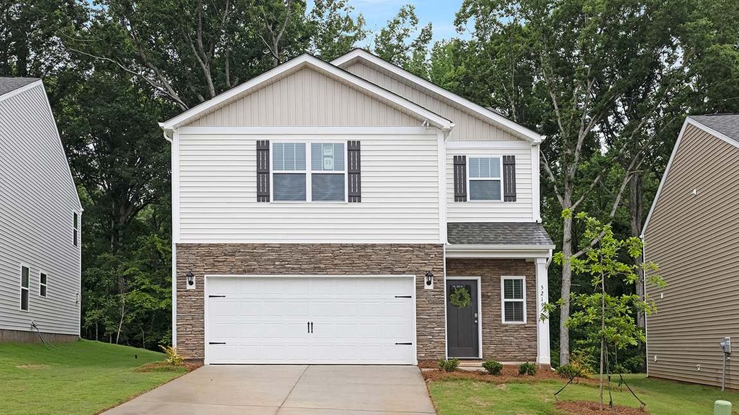 Front exterior of a new home in Bristol Terrace, Statesville, NC, highlighting curb appeal (Image 1). Front exterior of a new home in Bristol Terrace, Statesville, NC, highlighting curb appeal (Image 1).