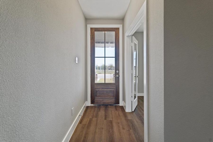 Entryway featuring dark wood-type flooring Entryway featuring dark wood-type flooring