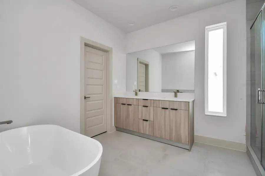 Primary Bedroom Bathroom with Spacious Walk-in Shower and Freestanding Tub Primary Bedroom Bathroom with Spacious Walk-in Shower and Freestanding Tub