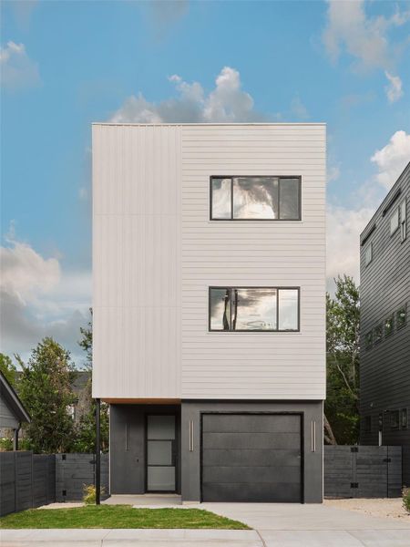 Contemporary home with driveway and an attached garage