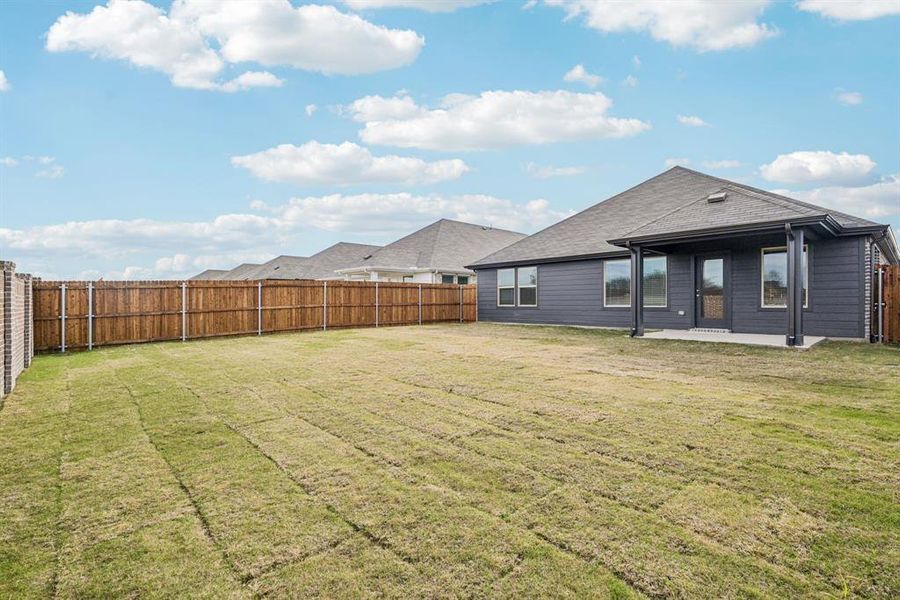 Exterior details and patio area of a home in Trails of Lavon - Signature Series, Lavon (Image 4).