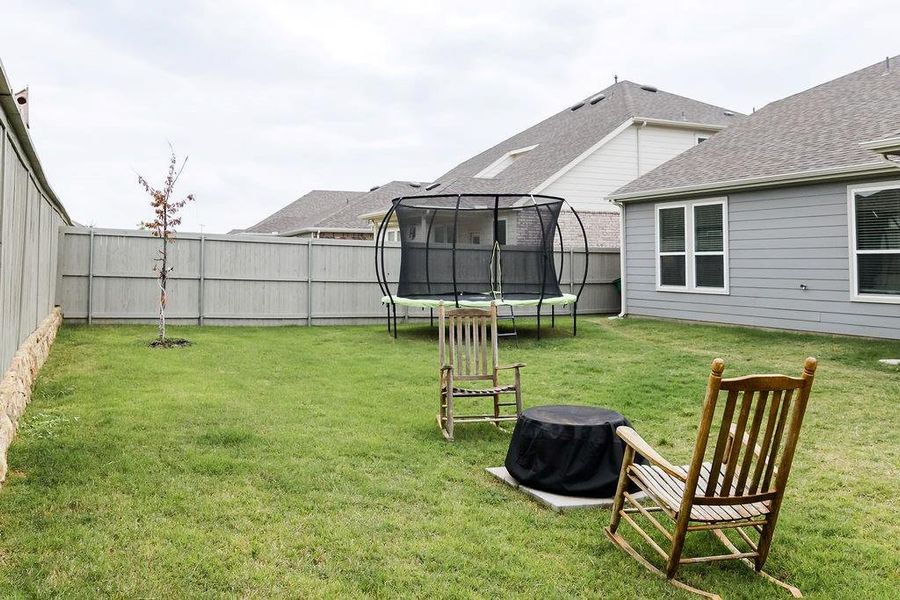 Exterior details and patio area of a home in Pecan Square, Northlake (Image 3).