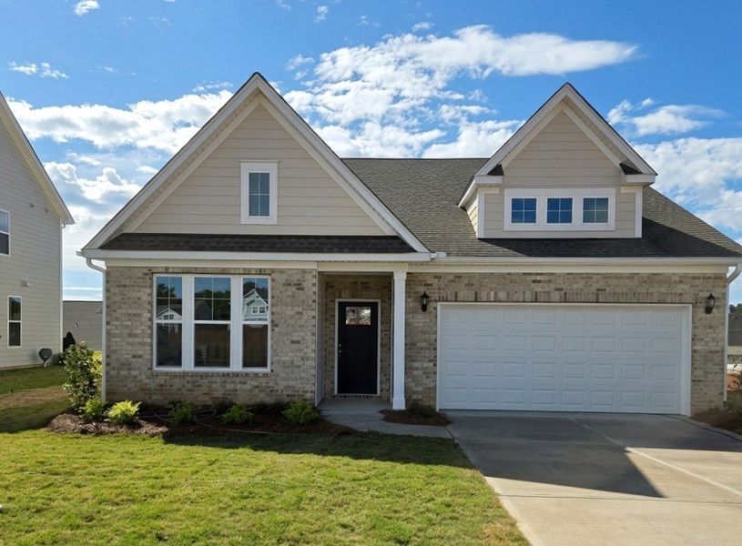 Front exterior of a new home in Cottages at Lake Emory, Inman, SC, highlighting curb appeal (Image 1). Front exterior of a new home in Cottages at Lake Emory, Inman, SC, highlighting curb appeal (Image 1).