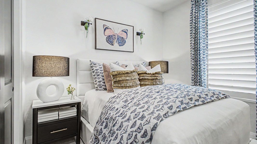 Secondary bedroom with butterfly accents in this quick move-in new home by DRB Homes at Saguaro Hills at Vistancia. Secondary bedroom with butterfly accents in this quick move-in new home by DRB Homes at Saguaro Hills at Vistancia.
