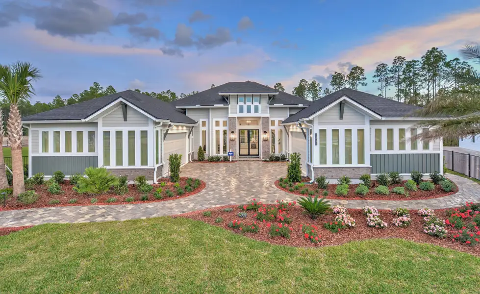 Front exterior of a new home in Courtney Grove, St. Augustine, FL, highlighting curb appeal (Image 1). Front exterior of a new home in Courtney Grove, St. Augustine, FL, highlighting curb appeal (Image 1).