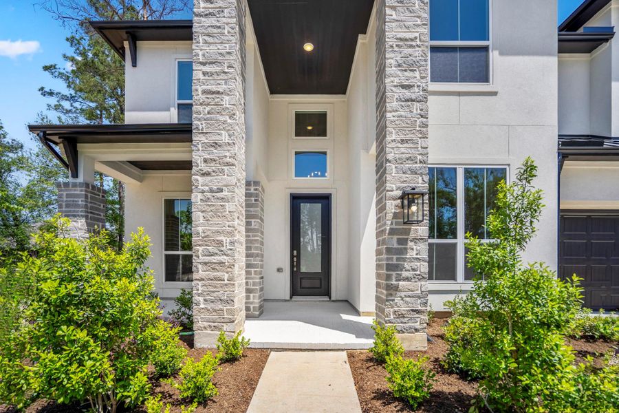 Exterior details and patio area of a home in ARTAVIA, Conroe (Image 3).